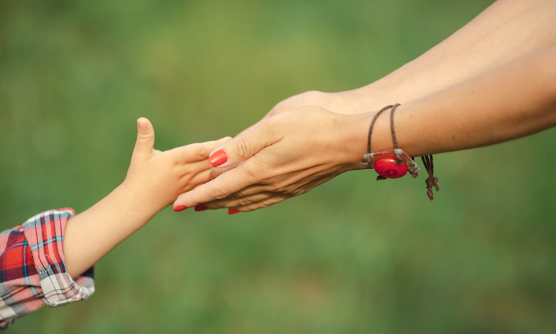 Establish-Paternity-Blog Parent and child hold hands