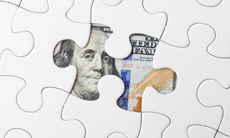 White puzzle and US dollar banknote Divorce Assets