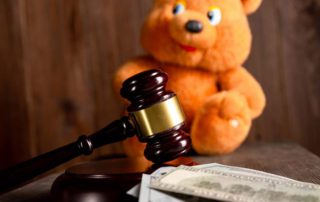 legal gavel and toy bear