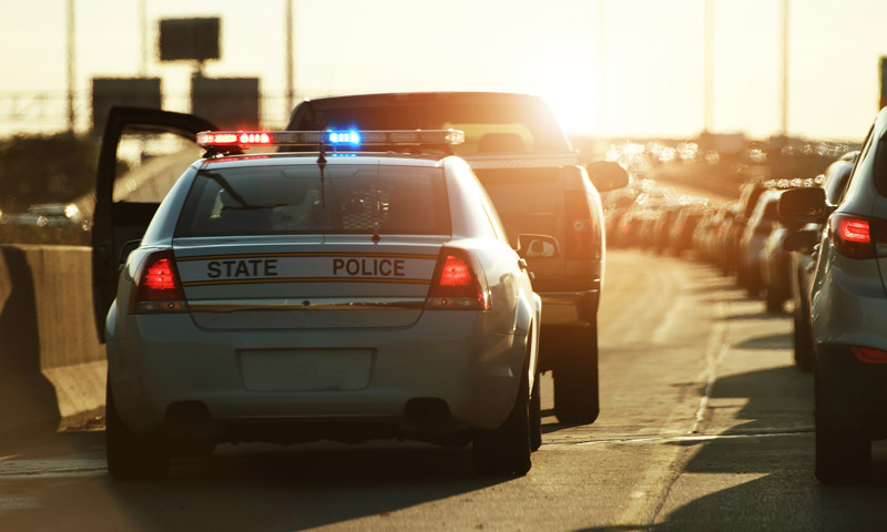 Officer-Car-Search-Blog Police pulling over a truck