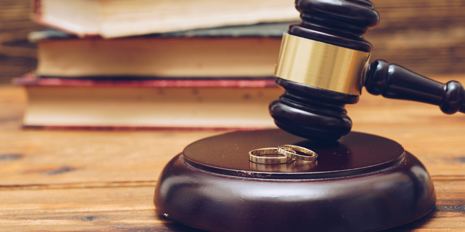Legal gavel and marriage rings